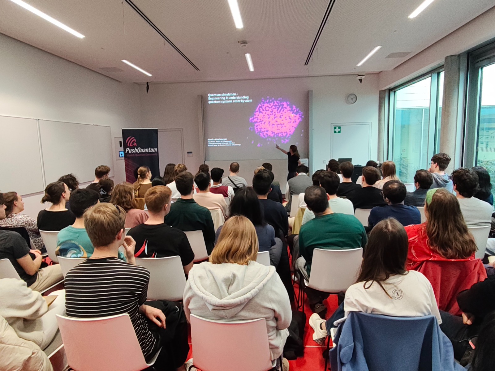 Speaker presenting at a PushQuantum seminar